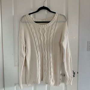 A long knitted sweater
